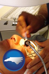 north-carolina map icon and lasik laser eye surgery for vision correction